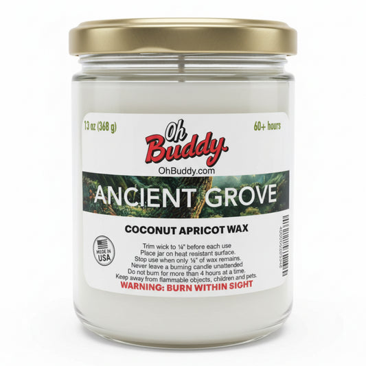 Jar of candle labeled 'Oh Buddy' with 'Ancient Grove' scent on a white background