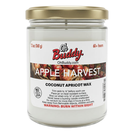 Jar of candle labeled 'Oh Buddy Apple Harvest' with coconut apricot wax on a white background