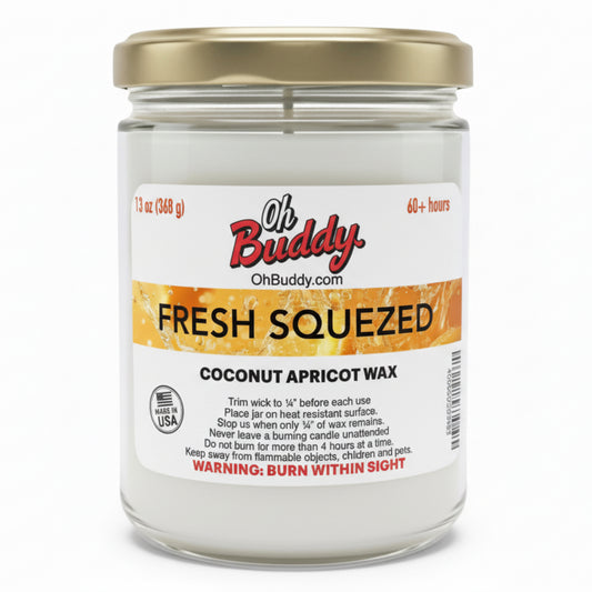 Jar of 'Fresh Squeezed' coconut apricot wax candle with 'Oh Buddy' label on a white background