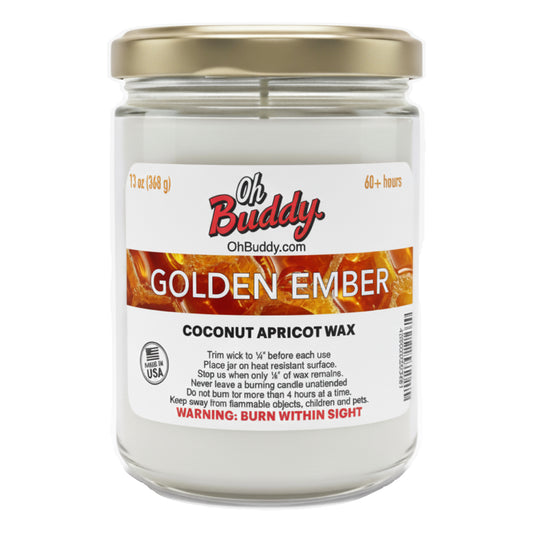 Jar of 'Golden Ember' candle with a gold lid on a white background