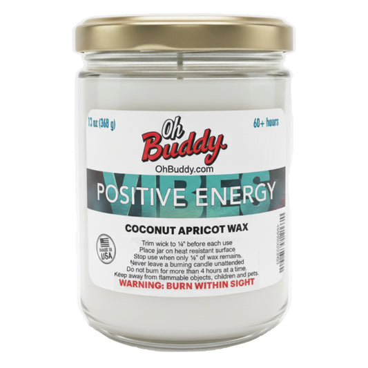 Candle jar labeled 'Oh Buddy Positive Energy' with a gold lid on a white background