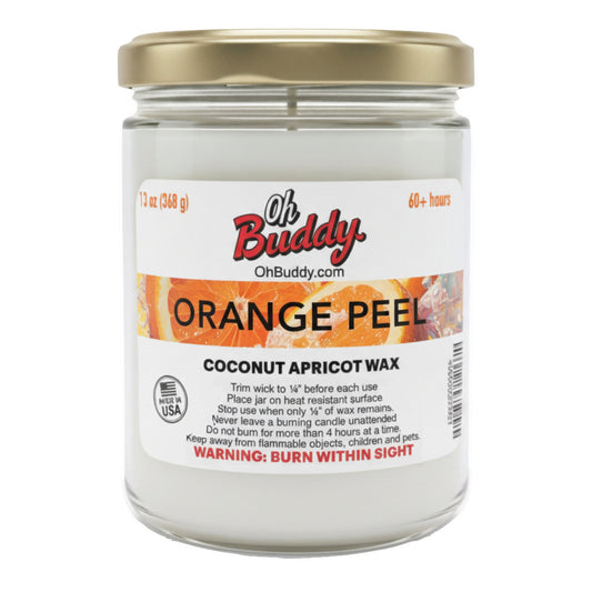 Candle jar labeled 'Oh Buddy Orange Peel' with a gold lid on a white background